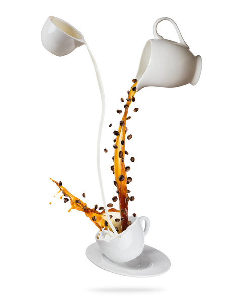 Splashing coffee drink with milk, isolated on white background - Foto, afbeelding