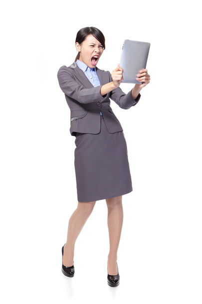 Business woman scream to tablet PC - Photo, image