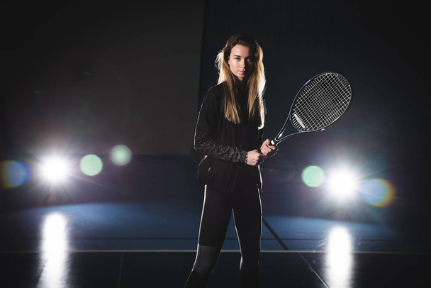 tennis player standing with racket in hand - Фото, изображение