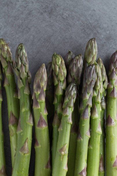 Bunch of asparagus. Organic, vegetarian and healthy food concept. Food background and textures. Closeup. Copy space - 写真・画像