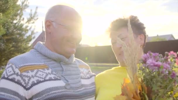 Senior couple is laughing at sunset - Footage, Video