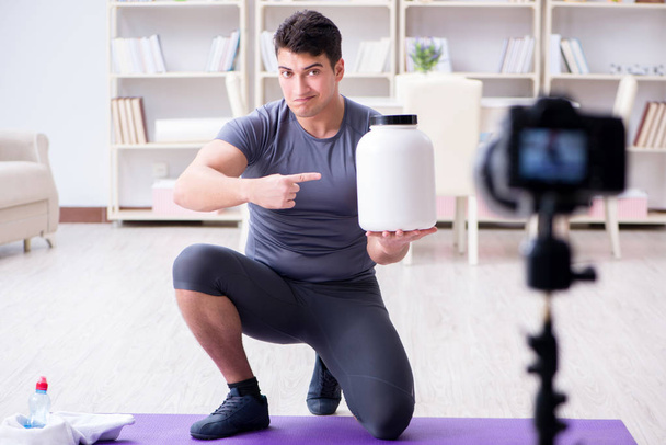 Sports and health blogger recording video in sport concept - Photo, Image