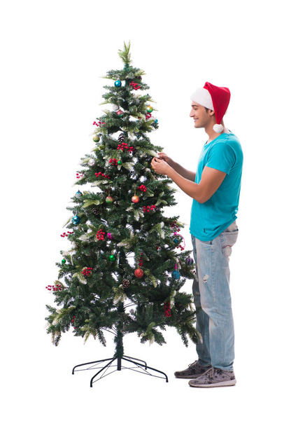 Fiatal férfi díszítő karácsonyfa elszigetelt fehér - Fotó, kép