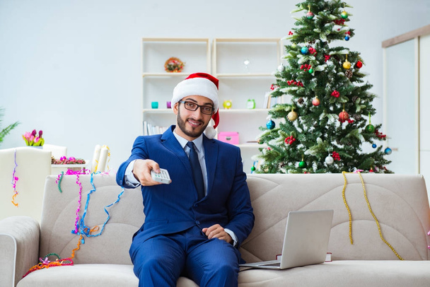 Businessman working at home during christmas - Photo, Image