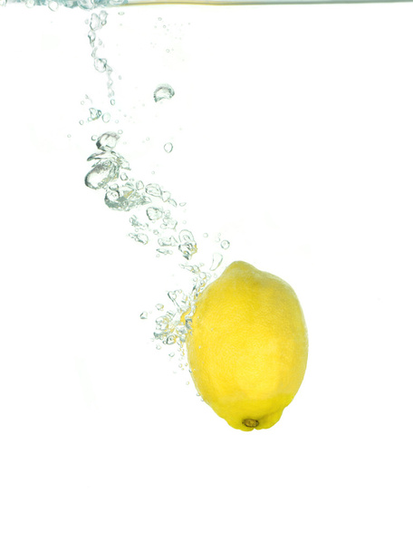 A lemon in clear water - Photo, Image