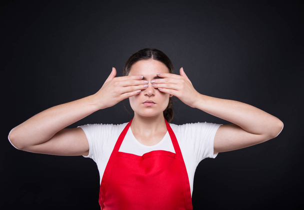 Beautiful employee closing eyes with hands - Photo, Image