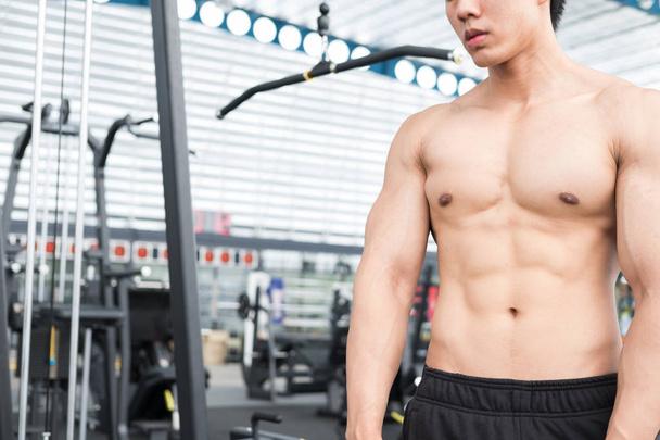 man athlete prepare for training in gym. bodybuilder male workin - Photo, Image