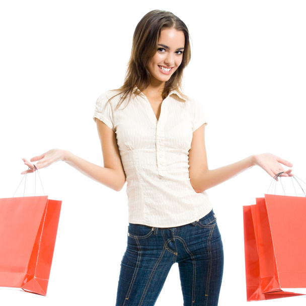 Young happy woman with shopping bags, isolated - Foto, Imagem