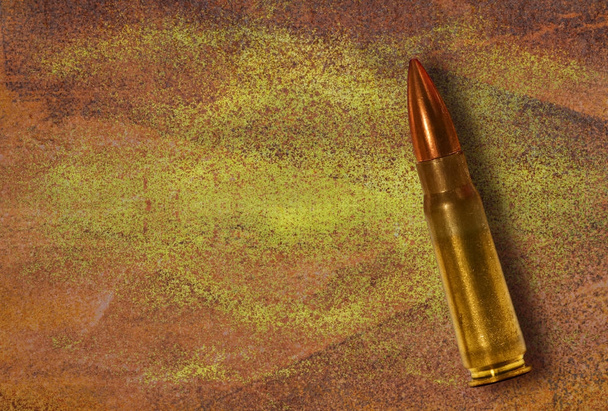 Bullet on grunge background - Photo, Image