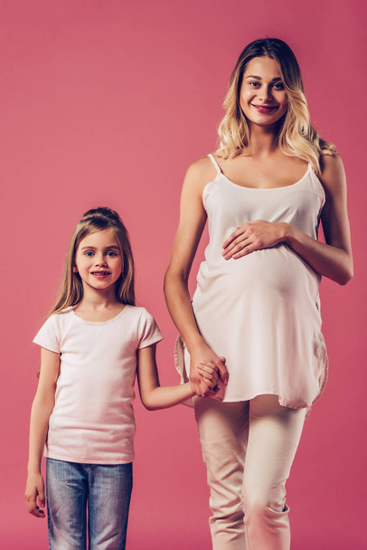 Pregnant woman with daughter isolated - Photo, Image