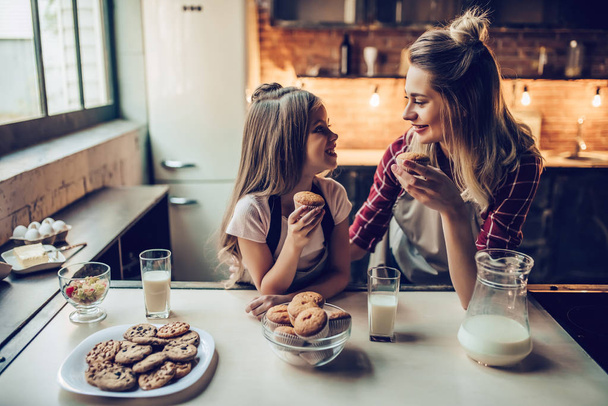 Mom with daughter on kitchen - Photo, Image