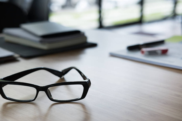 eyeglasses, notebook on office desk. business, workplace, educat - Zdjęcie, obraz