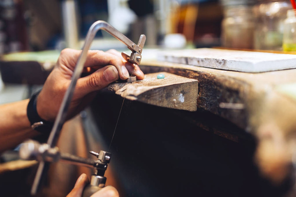 Jeweler using saw to create jewelry - Φωτογραφία, εικόνα