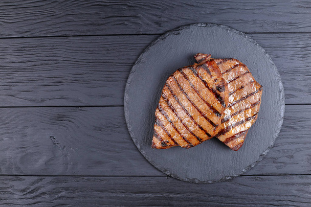 two grilled  beef steaks with stripes - Foto, Bild