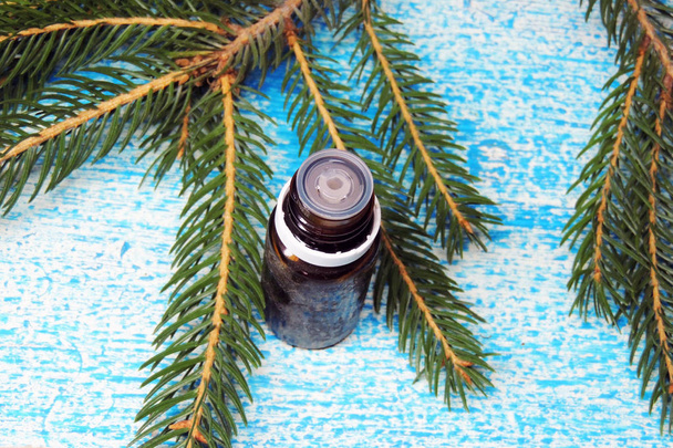Essential oil and sprig of pine - Photo, Image