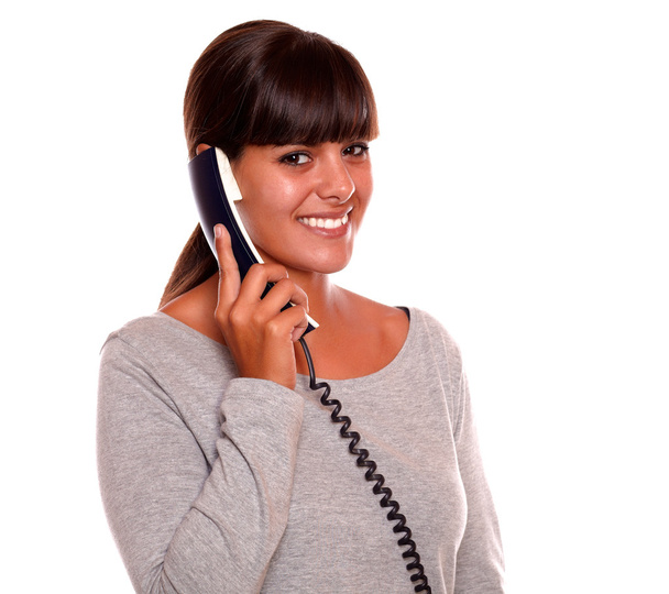 Beautiful young female speaking on phone - Foto, imagen