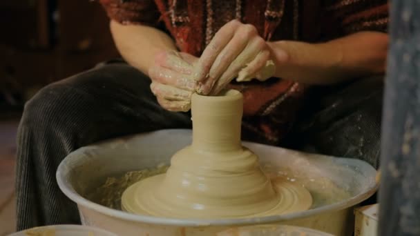 Professional male potter making ceramics in workshop - Footage, Video