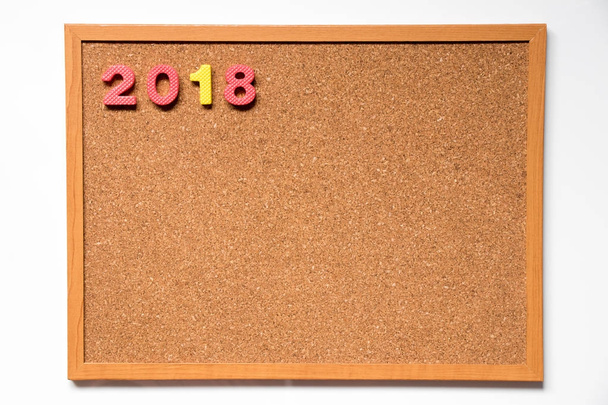 Cork board with number as 2018 wording on white background - Fotó, kép