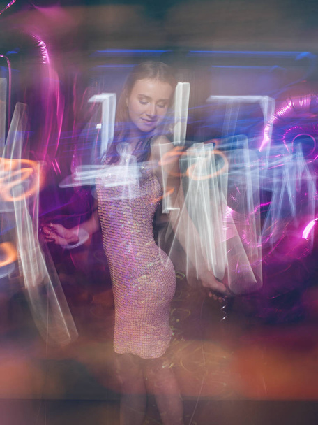 Stylish female at party in blurred colors - Foto, Bild
