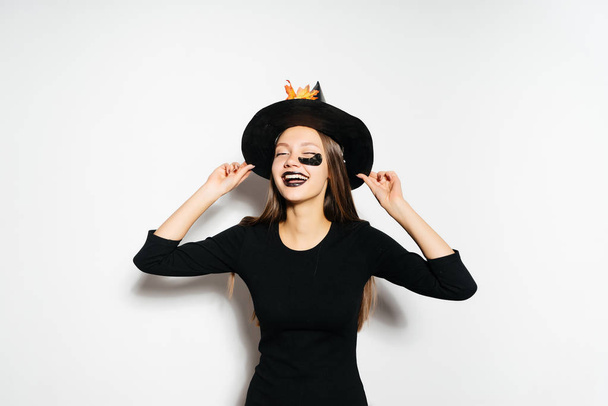Wide Halloween party art design Halloween Witch in a black terrible hat smiles.  - Foto, Imagen