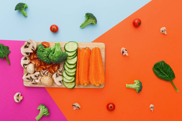 Vihannekset värikkäällä abstraktilla taustalla, terveellinen ruoka
 - Valokuva, kuva