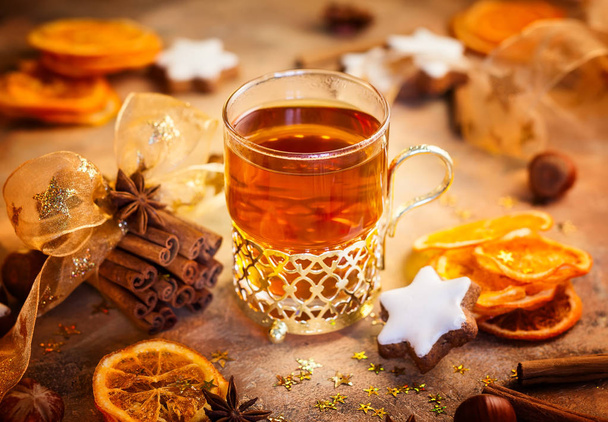 Winter spiced tea, gingerbread stars and Christmas spices  - Φωτογραφία, εικόνα