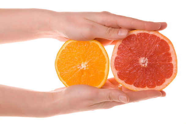 Hands holding sliced orange and grapefruit - Фото, изображение