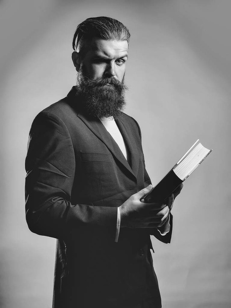 Bearded handsome man with book - 写真・画像