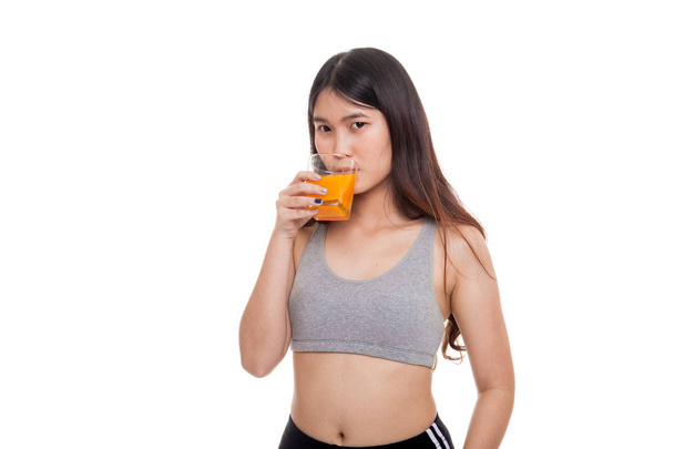 Beautiful Asian healthy girl drinking  orange juice. - Zdjęcie, obraz