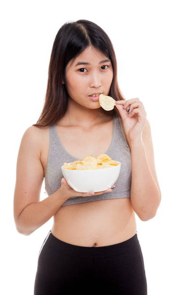 Beautiful Asian healthy girl  eat potato chips. - Fotoğraf, Görsel