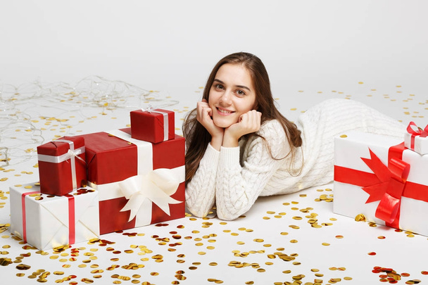 Young girl with gifts isolated on white background. - Foto, Bild