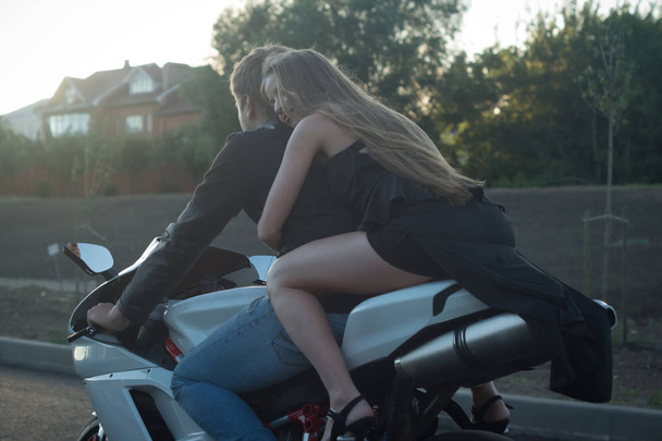 Active couple riding on the motorbike - 写真・画像