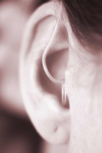 Hearing aid in ear - Photo, Image