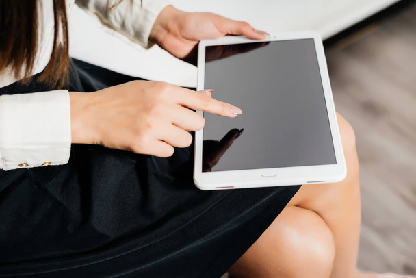 young business lady holding a tablet and working with a crypto currency - Photo, Image