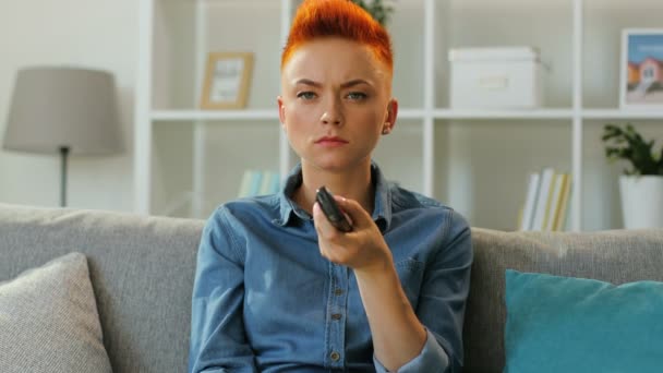 woman using tv remote control - Video, Çekim