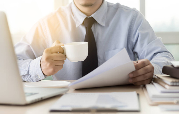 Businessman working reading documents graph financial to job suc - Фото, изображение