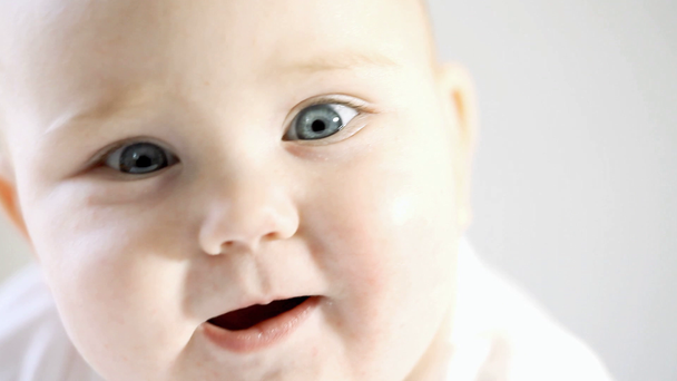 bright closeup portrait of adorable baby - Footage, Video