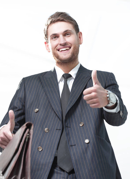 closeup.successful businessman showing thumb up . - Foto, afbeelding