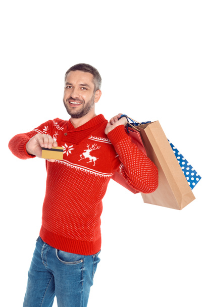 Homem com sacos de compras e cartão de crédito
 - Foto, Imagem