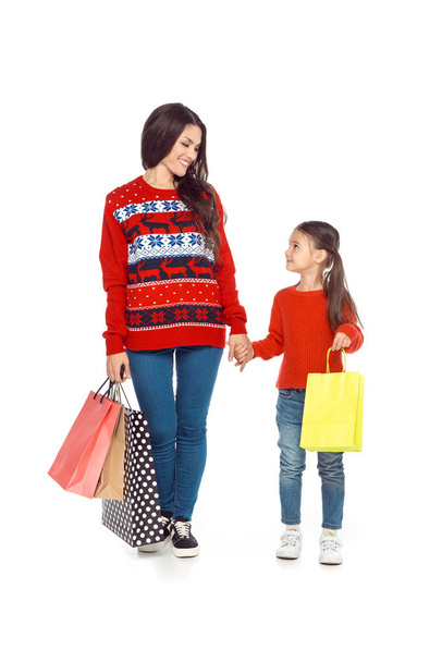 mother and daughter with shopping bags - Foto, Bild