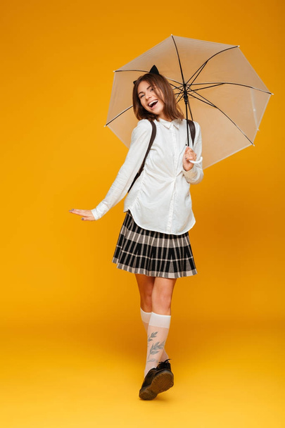 Full length portrait of a smiling young schoolgirl - Photo, Image