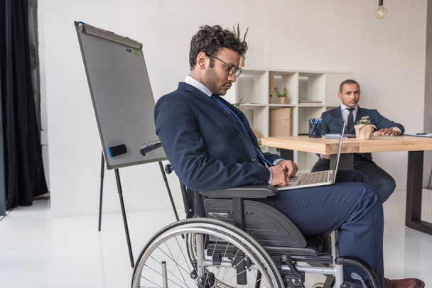 disabled african american businessman with laptop - Fotoğraf, Görsel