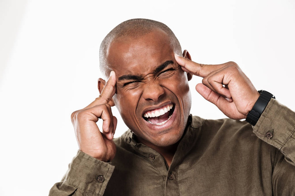 Displeased young african man with headache - Фото, зображення