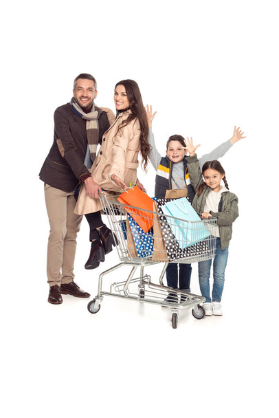 family with shopping cart  - Фото, зображення