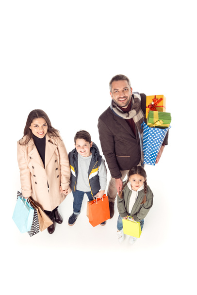 family holding shopping bags - Fotó, kép