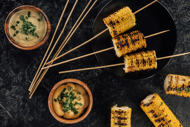 grilled corn pierced with sticks - Photo, image