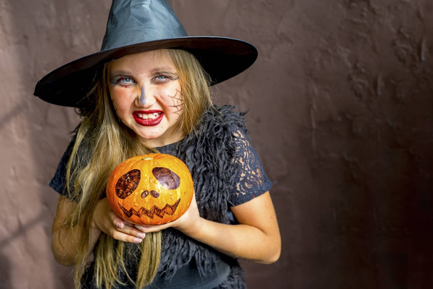 Girl in witch costume - Фото, изображение