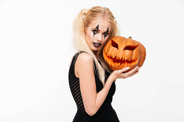 Portrait of a pretty blonde woman in halloween make up - Photo, Image