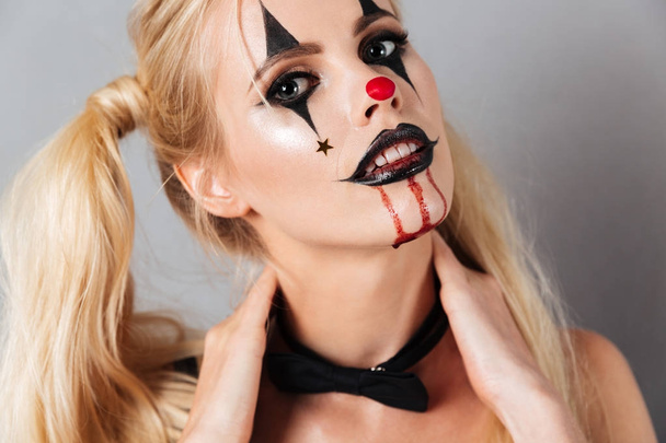 Close-up image of young blonde woman in halloween make up - Foto, Bild