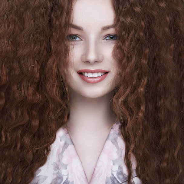 beautiful smiling girl with curly hair - Zdjęcie, obraz